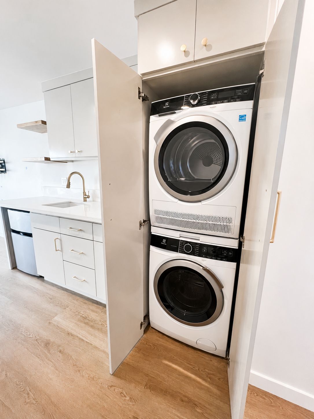 In-unit stacked washer and dryer closet