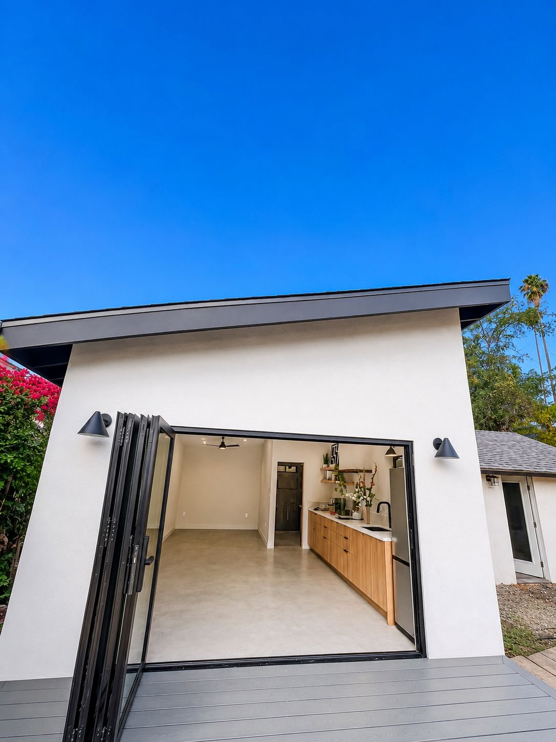 Finished ADU exterior with open bi-fold door