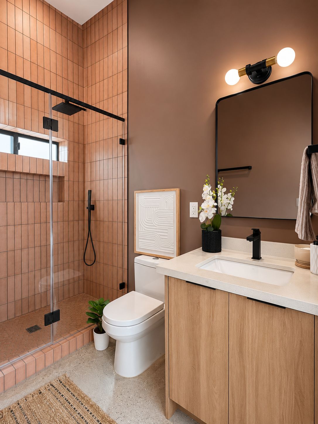 Full bathroom view with vanity and terracotta tile shower