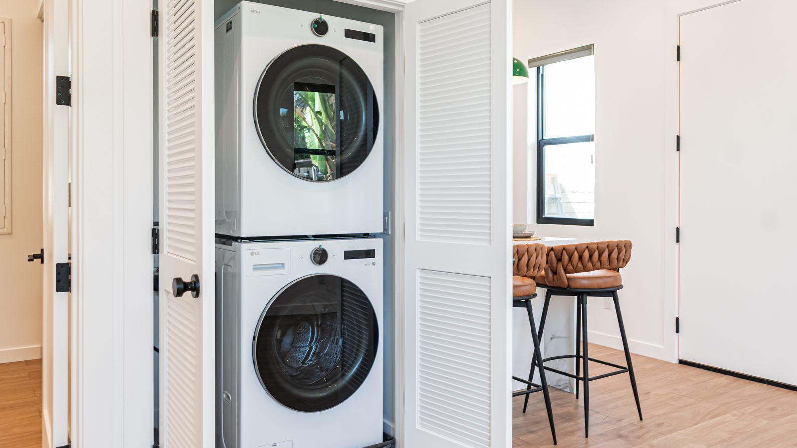 In-unit stacked washer and dryer closet