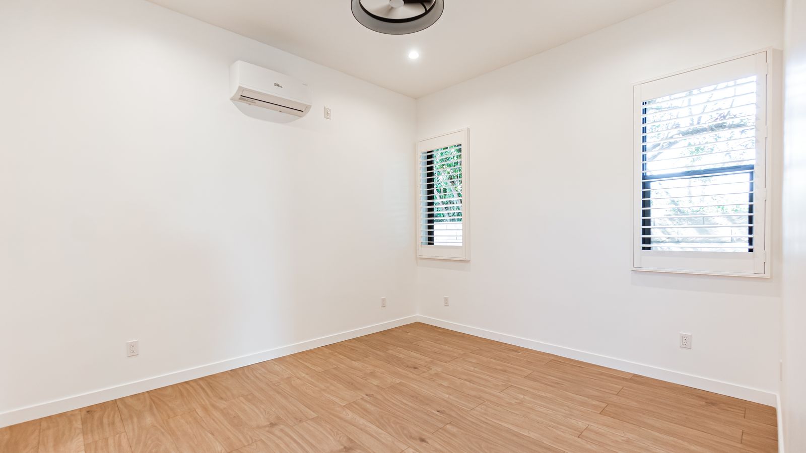 Second bedroom with mini-split AC and ceiling fan