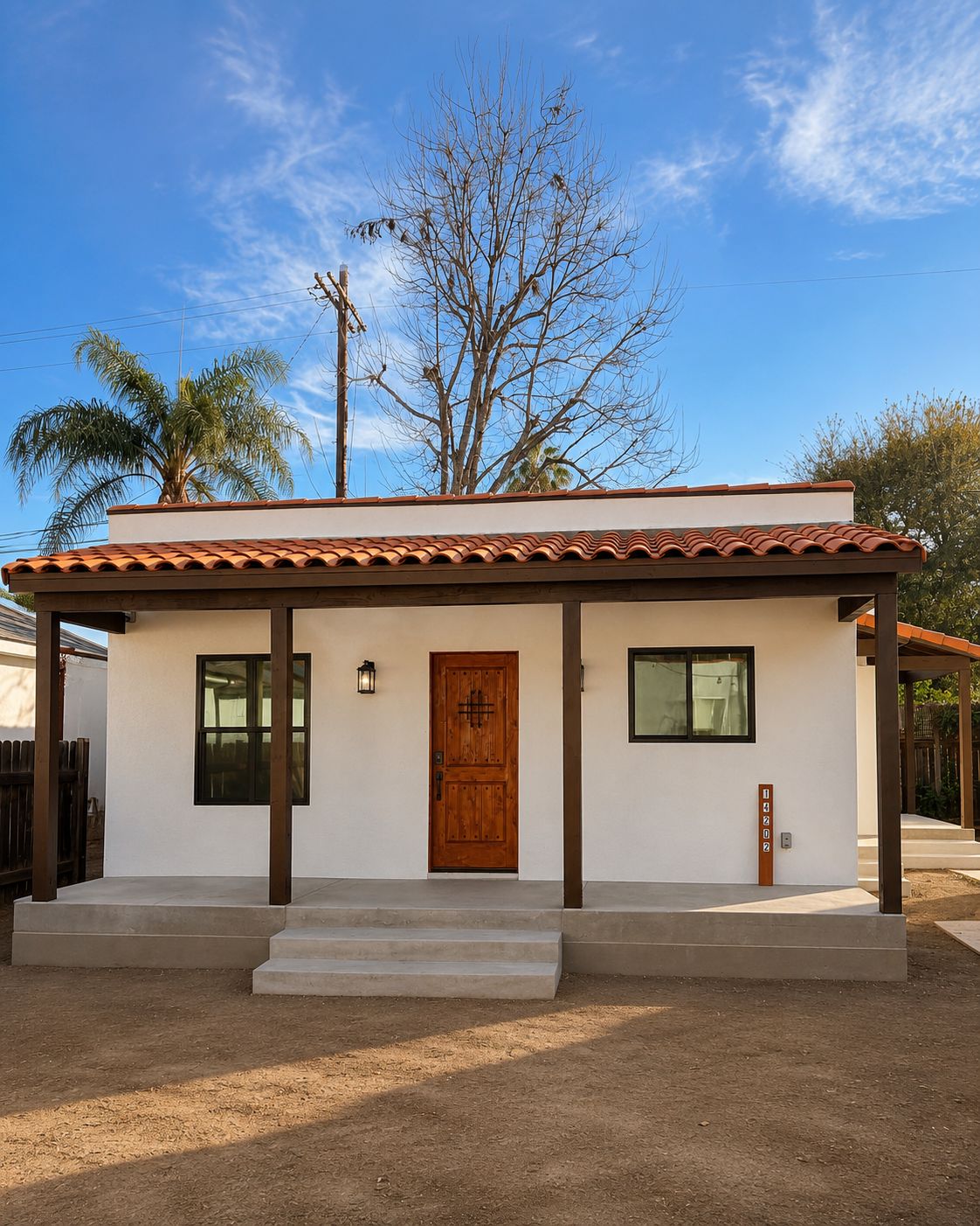 Front elevation with covered porch and address numbers