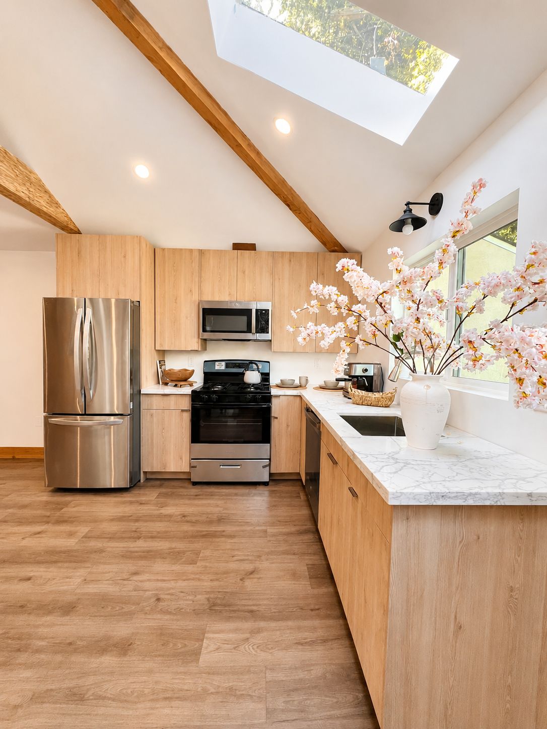 Kitchen with stainless appliances and marble countertop