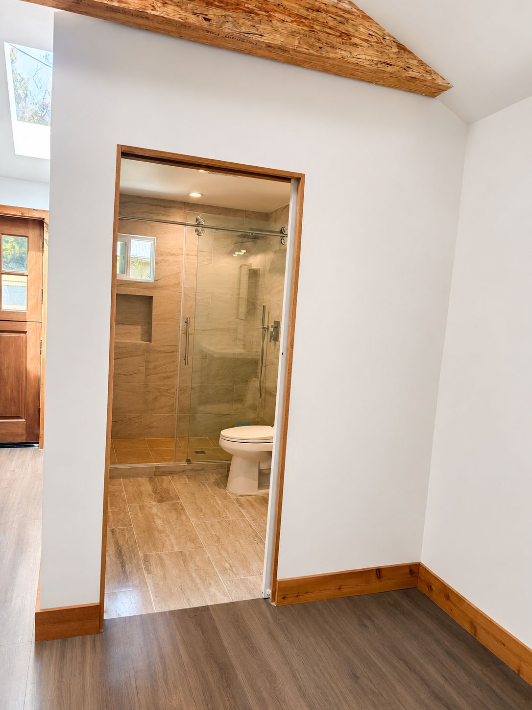 Hallway view into the finished bathroom