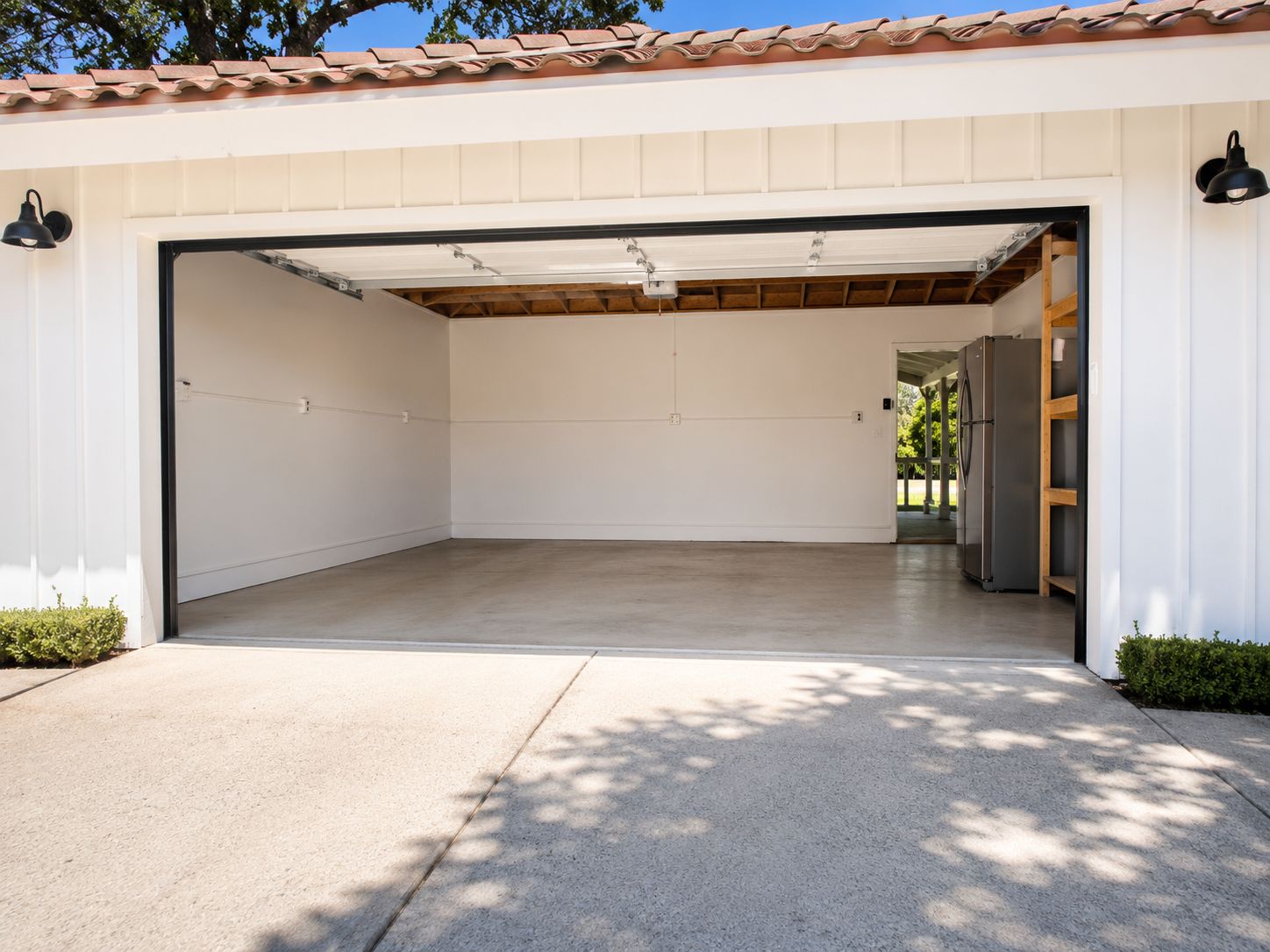 Garage exterior before conversion, door open